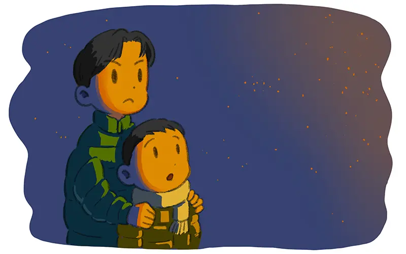 どんと焼きの火を見る兄弟